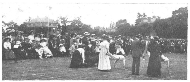 Photo of a wheelbarrow race at a garden party c.1900