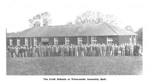 Group photograph of members of the craft school outside the Winscombe Assembly Hall