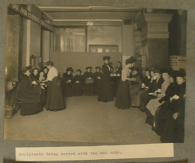 Photo of women serving tea and cake