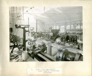 Black and white photograph of motor car workshop