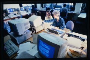 Photo of two women using computers